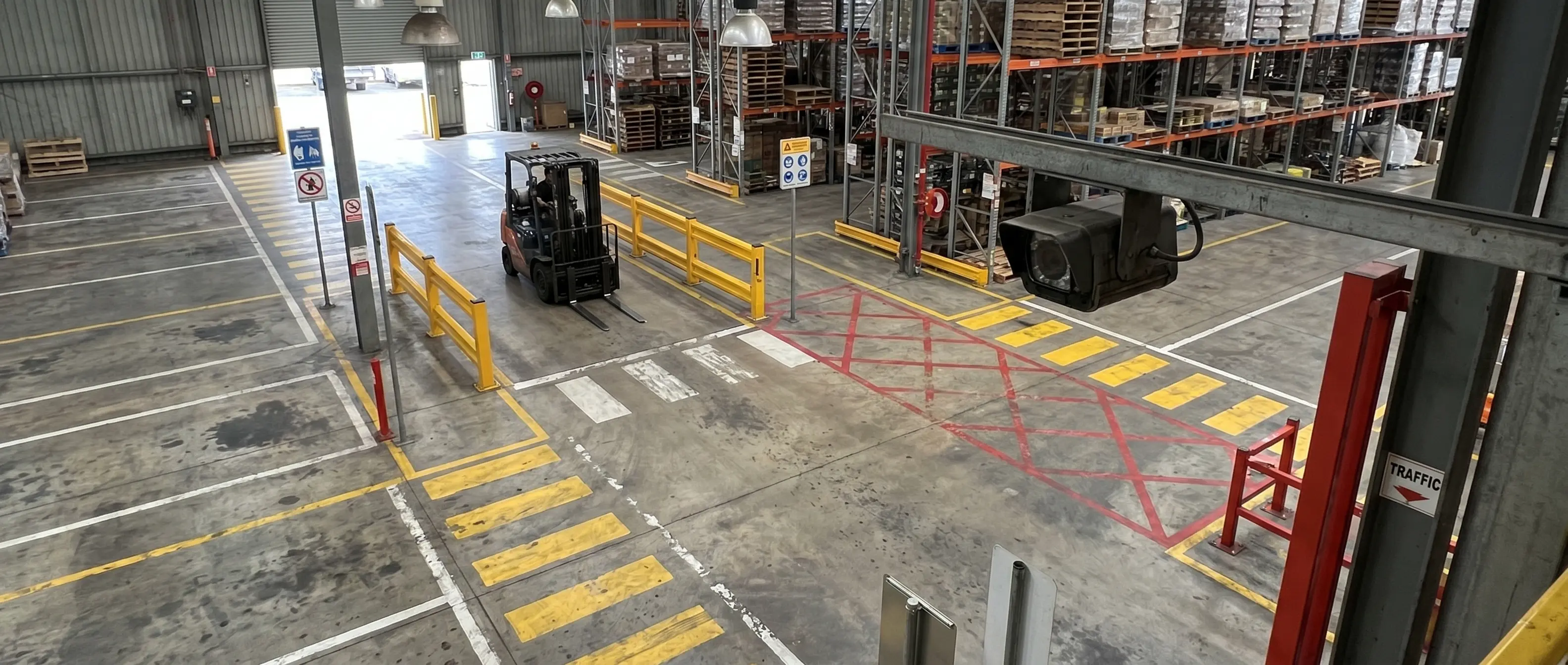 Layered traffic management plan in an industrial facility with forklifts, pedestrians, and AI cameras